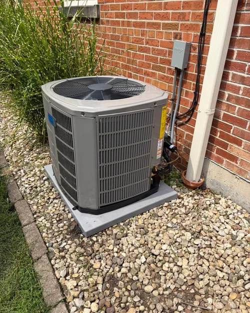 New outdoor air conditioner, set on a level pad